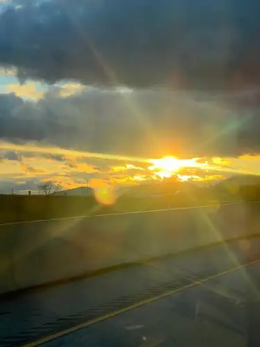 Chasing the sun's last rays on the highway.